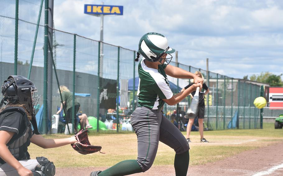 Naples' Alexia Malaca swings at an approaching pitch Saturday, May 21, 2022, at the DODEA-Europe Division II/III softball championships at Kaierslautern, Germany.