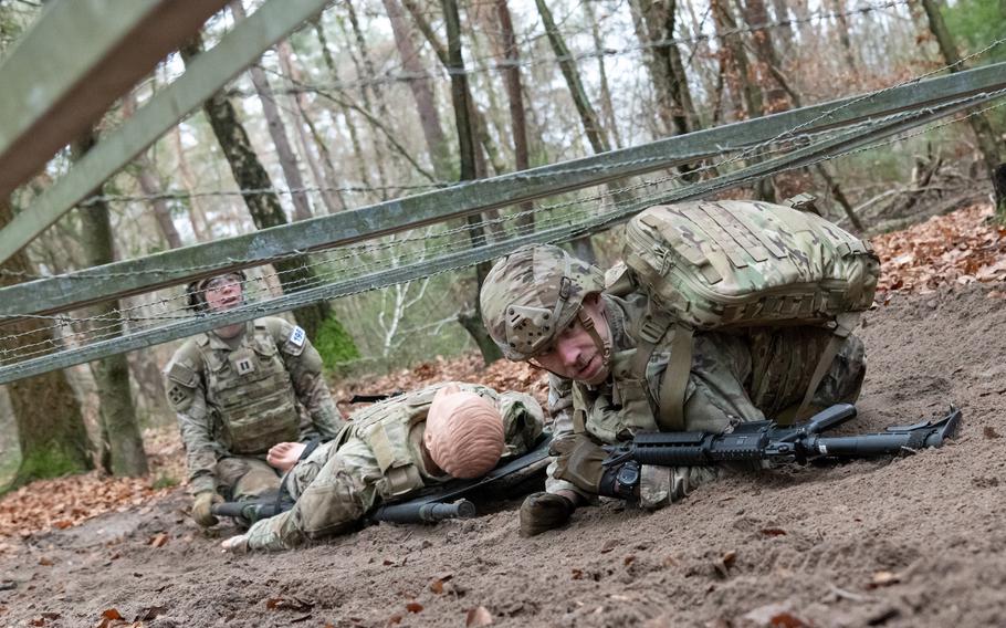 Two American soldiers participate in a medical competition.