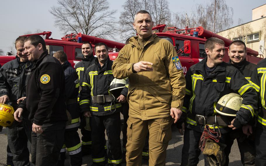 Kyiv Mayor Vitali Klitschko visits with city firefighters to thank them for helping protect the city during Russian strikes. 