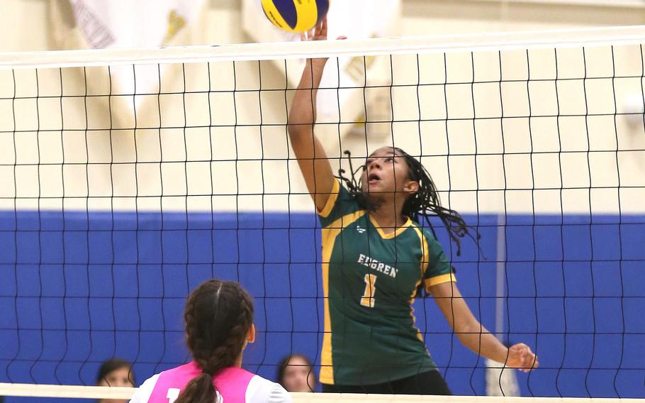 Edgren's Nia Tyler skies to hit the ball against Zama in Tuesday's Far East Division II volleyball tournament elimination round. The Trojans won in three sets.