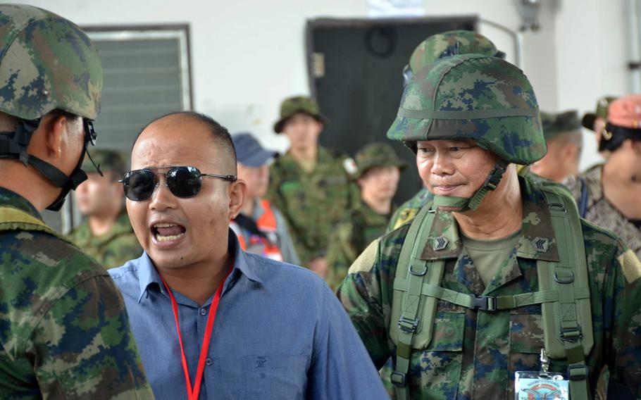A Thai man acting as an irritated evacuee yells at soldiers during a Cobra Gold drill in Rayong, Thailand, on March 3, 2024. 
.