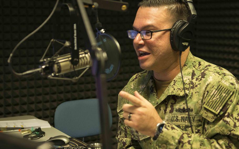 Petty Officer 3rd Class Joe Cardona, assigned to the American Forces Network in Naples, Italy, in the radio studio during a talk show in 2020.