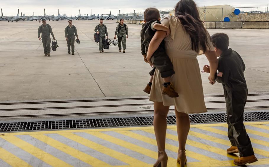 Family members of a U.S. Marine wait to reunite with their service member after returning from deployment with the 26th Marine Expeditionary Unit, Marine Corps Air Station New River, N.C., Saturday, March 16, 2024.