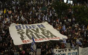 People protest against Israeli Prime Minister Benjamin Netanyahu's government and call for the release of hostages held in the Gaza Strip by the Hamas militant group in Tel Aviv, Israel, Saturday, June 1, 2024. (AP Photo/Maya Alleruzzo)