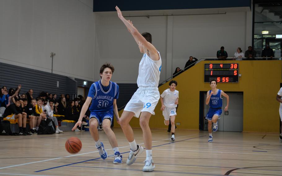 Rota's Hampton Brasfield is stopped in a sprint for the basket by Marymount's defender Patrick Gianni during the DODEA European Division II boys basketball championships Feb. 16, 2023, at Ramstein Air Base, Germany. Rota bested Marymount 42-14 on the second day of competition play.