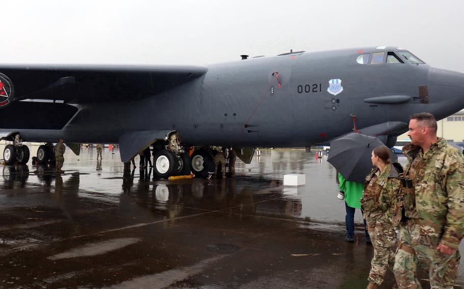 U.S. airmen patrol a B-52H Stratofortress assigned to the 96th Bomb Squadron out of Barksdale Air Force Base, La., at Cheongju International Airport, South Korea, Thursday, Oct. 19, 2023.