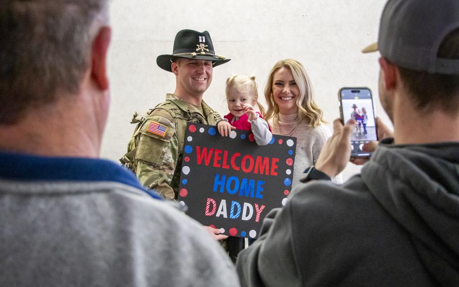 Capt. Jon Gronewold is greeted by family and friends, including his wife Emily and daughter Ada, 2, during his welcome home Saturday, Jan. 13, 2024, at Eppley Airfield in Omaha, Neb.