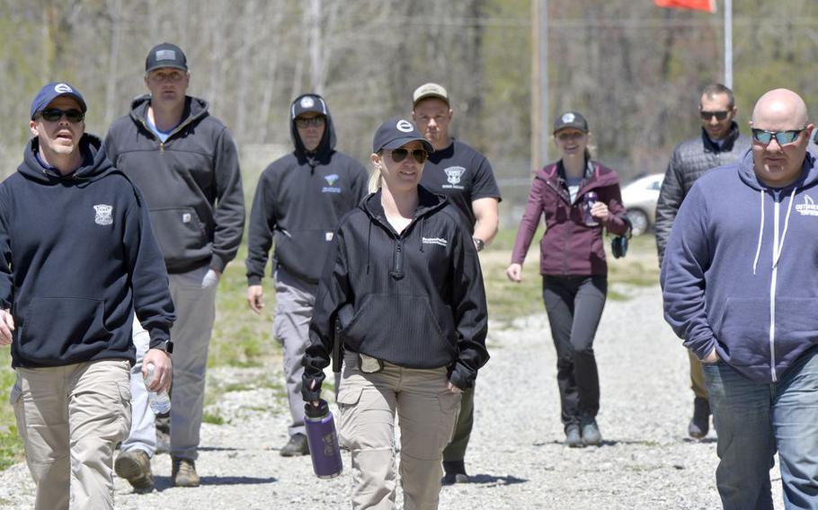 Attendees arrive for the afternoon session of Joint FBI and Westover Post Blast Investigation Training held at Westover Air Reserve Base in Chicopee, Mass.