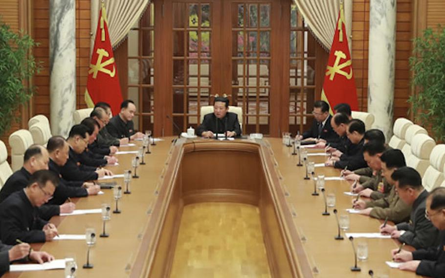 North Korean leader Kim Jong Un, center, presides over a Central Committee meeting of the Worker’s Party of Korea on Jan. 19, 2022. 