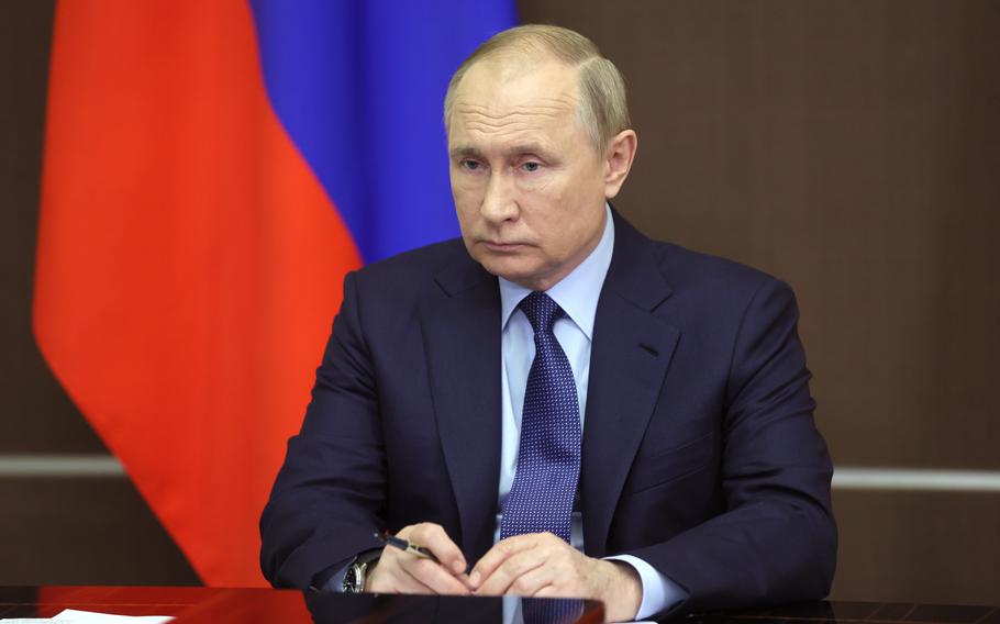 Russian President Vladimir Putin attends a cabinet meeting via video link, at the Bocharov Ruchei residence in the Black Sea resort of Sochi, Russia, Wednesday, Nov. 24, 2021.