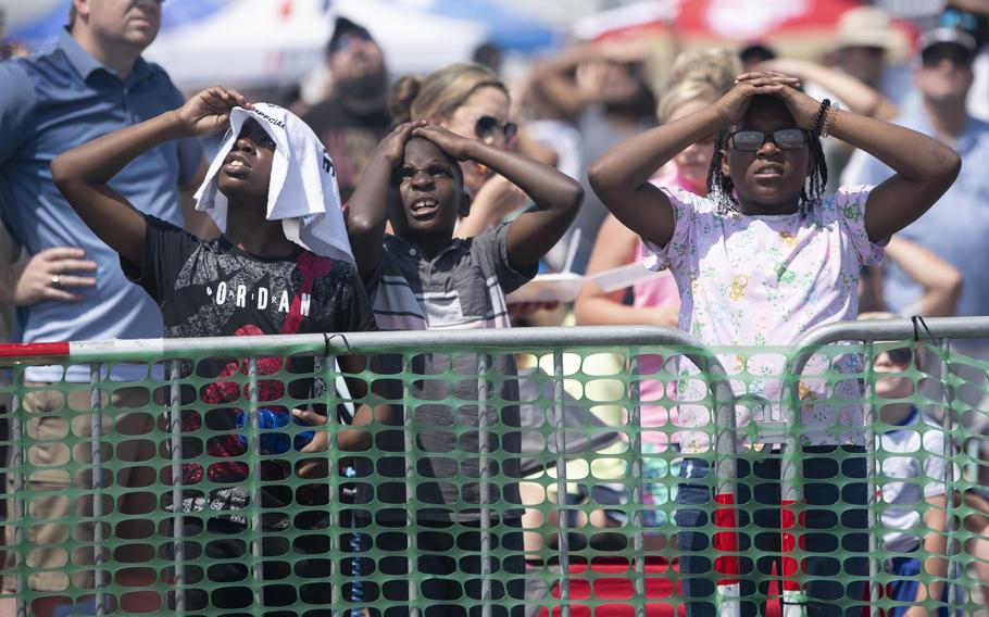 The crowd watches the Wings of Blue perform during the Charleston Airshow at Joint Base Charleston, S.C., Saturday, April 20, 2024. 