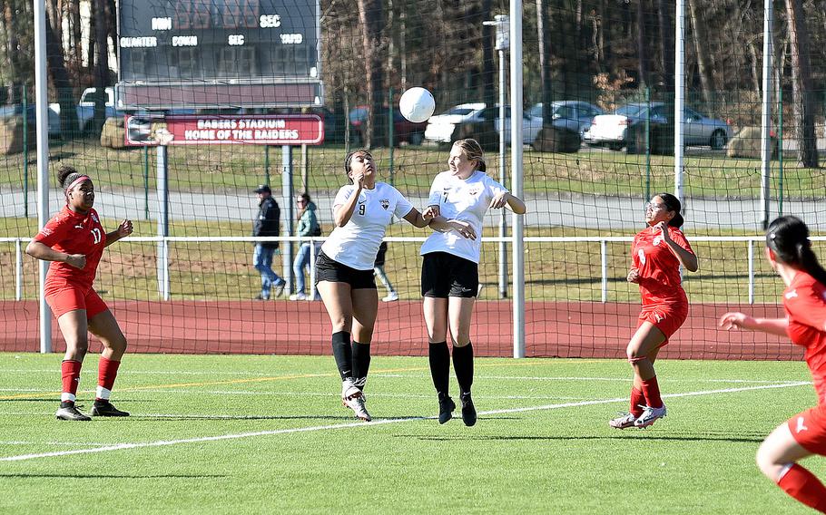 Stuttgart defenders Ayana Gomex, left, and Clara Thompson go up to head a ball during a girls soccer match on March 9, 2024, at Kaiserslautern High School in Kaiserslautern, Germany.