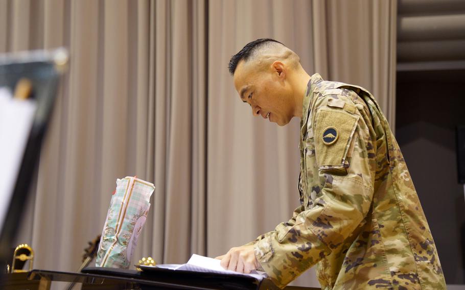 Chief Warrant Officer 3 Matthew David, commander of the U.S. Army Japan Band, conducts U.S. and Japanese musicians during a joint rehearshal at Camp Zama, Dec. 13, 2023. 