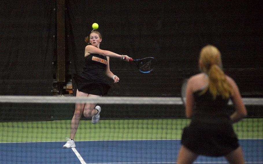 Spangdahlem's Natalie Moran hits the ball as she and teammate Sandrine Bennett play against Annika Svenson and Addie Wilson of Vicenza in pool-play action of the DODEA European tennis championships on Oct. 19, 2023, at T2 Sports Health Club in Wiesbaden, Germany.