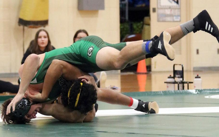 Kubasaki's Hayden Potter gains the upper hand on Kadena's Kai Christy at 158 pounds during Wednesday's Okinawa wrestling dual meet. Potter pinned Christy in 2 minutes, 31 seconds, but the Panthers won the meet 31-31 by virtue of more bouts won.