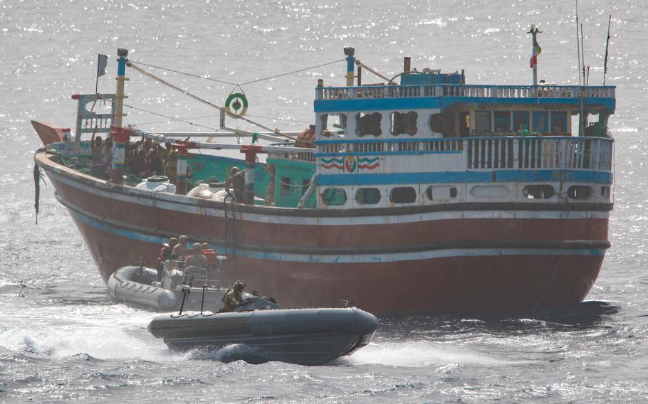 An interdiction team from the destroyer USS Momsen boards a fishing vessel May 16, 2022, in the Gulf of Oman. The vessel was seized while transiting international waters. 