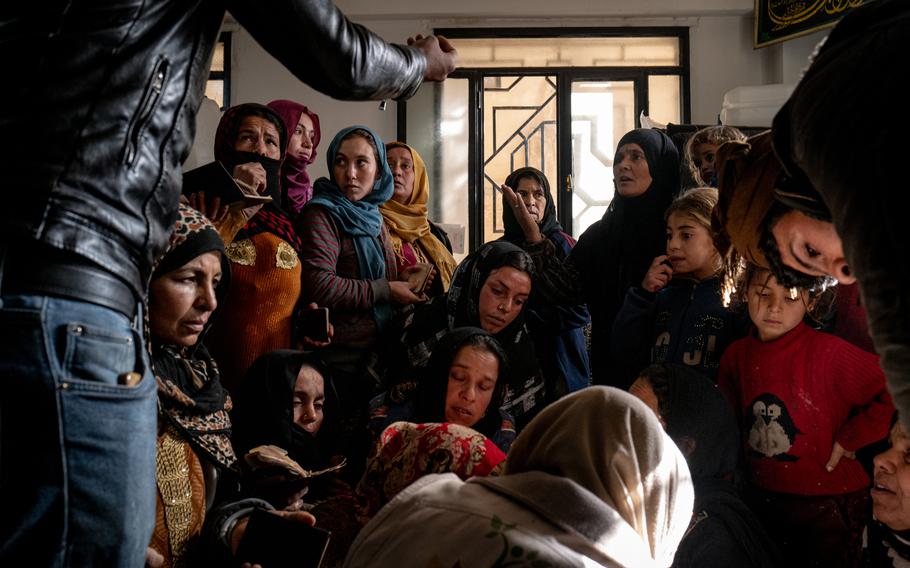 Women register for aid at a makeshift shelter for displaced residents in the Mossab bin Ummayr mosque on Feb. 1 in Hasakah, Syria. 