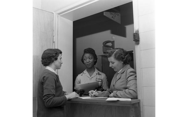 97th General Hospital, Frankfurt, Germany, Feb. 1, 1957: Ms. A. Baker (center) and two unidentified females stand at the 97th General Hospital Maternity Ward's Receptionist Office. 

Looking for Stars and Stripes’ historic coverage? Subscribe to Stars and Stripes’ historic newspaper archive! We have digitized our 1948-1999 European and Pacific editions, as well as several of our WWII editions and made them available online through https://starsandstripes.newspaperarchive.com/

META TAGS:  military medical; fixed medical treatment facility; way of life; military family; health care; Army;women in the military; Women's History Month