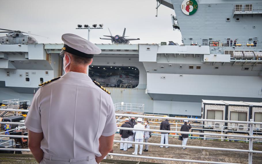 U.S. Navy Capt. Rich Jarrett, commander of Yokosuka Naval Base, Japan, watches as the aircraft carrier HMS Queen Elizabeth arrives on Sept. 4, 2021.
