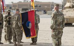 The color guard presents their unit’s colors during the 29th Infantry Division’s transfer-of-authority ceremony Dec. 19, 2016 at Camp Arifjan, Kuwait. The 29th Infantry Division is organized to provide oversight to some 18,000 troops in U.S. Army Central’s area of operations, the largest number of troops the unit has taken command of since the end of World War II. (U.S. Army photo by Sgt. Angela Lorden)