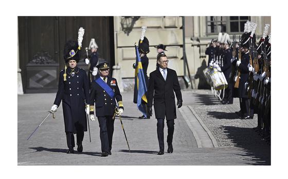 Swedish King Carl Gustaf, left, and President of Finland Alexander Stubb, review the Grenadier Guards of the Life Guards at the Royal Palace in Stockholm, Sweden, on Tuesday, April 23, 2024. 