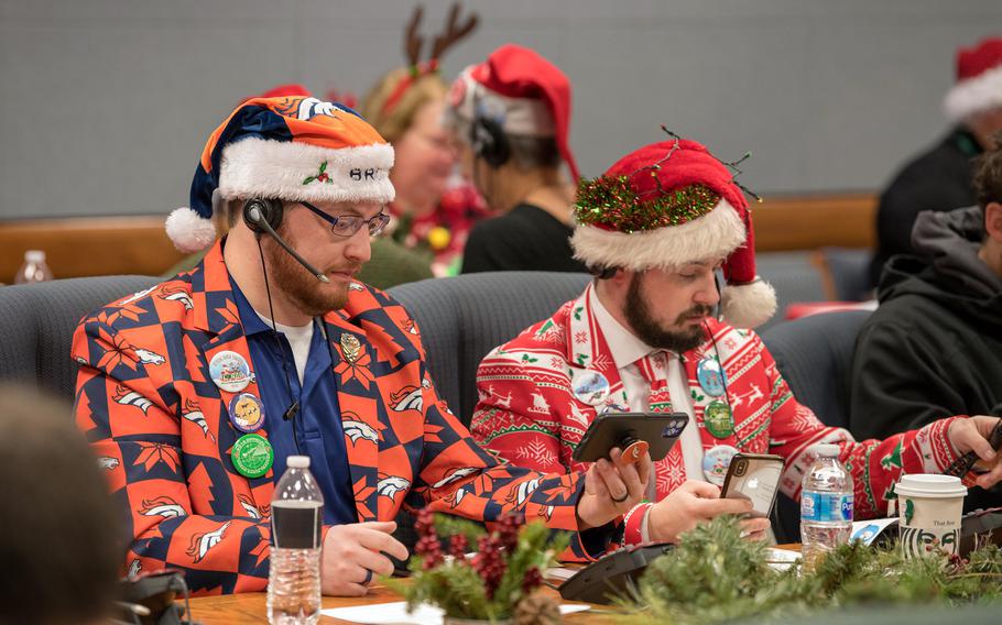 NORAD Tracks Santa volunteers answer phones and emails from children around the globe in 2019 during the annual  event in Colorado Springs, Colo.