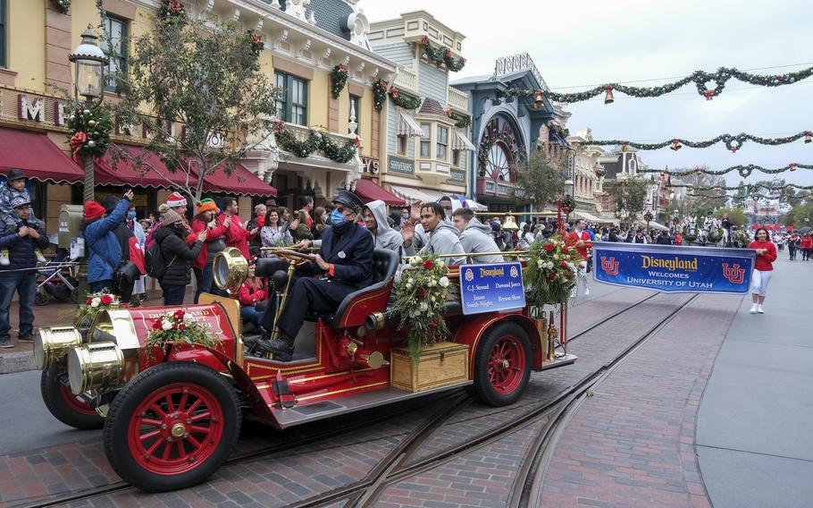 Ohio State players C.J. Stroud, Dawand Jones, Jax Smith-Njigba and Bryson Shaw wave on a vehicle in a parade for the Rose Bowl Team Visit Disneyland Resort in Anaheim, Calif., Monday, Dec. 27, 2021. 