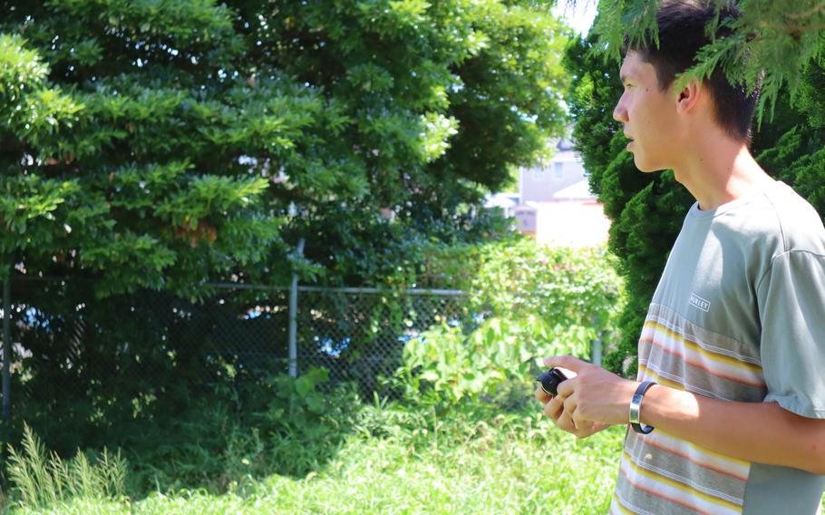 Taiyo Reimers, seen here filming at the Navy's Negishi housing annex in July 2022, documented the history and demolition of the annex in Yokohama, Japan.