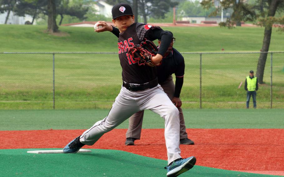 E.J. King right-hander David Armstrong delivers during Tuesday's Division II baseball playoffs. The Cobras rallied past Yokota 10-9 to reach Thursday's final against defending champion Zama.