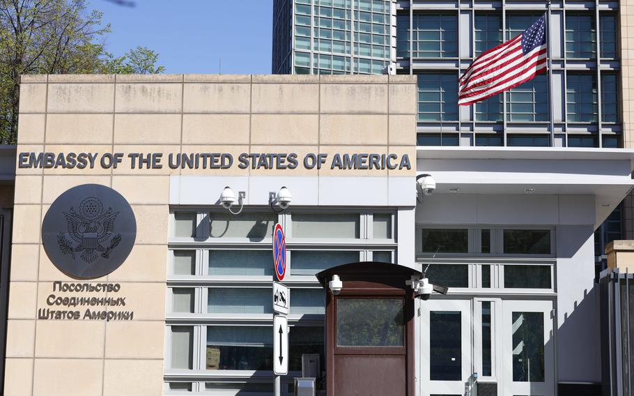 The U.S. Embassy and the National flag are seen in Moscow, Russia, Tuesday, May 11, 2021. Under Kremlin orders, the U.S. Embassy has stopped employing Russians, leaving Russian businessmen, lovers and exchange students adrift because they can’t get visas and American parents unable to register their newborns as citizens.