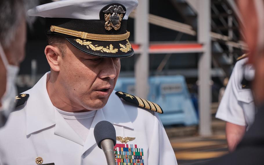 Capt. Fred Goldhammer, commander of the USS Ronald Reagan, speaks to reporters at Yokosuka Naval Base, Japan, Friday, May, 20, 2022, ahead of the aircraft carrier’s annual patrol. 