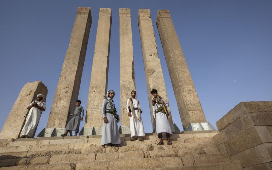 Armed men allied to Yemen’s internationally recognized government pose for a photograph at Awwam Temple, also known as the Mahram Bilqis, in Marib, Yemen, on June 21, 2021. UNESCO on Wednesday Jan. 25, 2023 added one of Yemen’s ancient kingdoms and a Lebanese modernist concrete fair park to its list of World Heritage sites in danger, the latest entries from The Middle East.