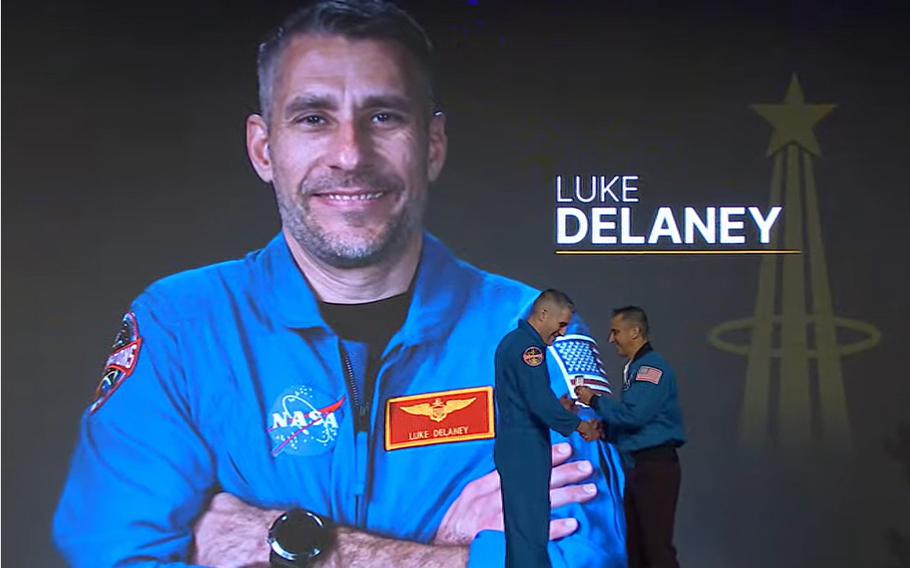 Luke Delaney receives his official astronaut wings from Chief of the Astronaut Office Joe Acaba during the graduation ceremony for the 23rd astronaut group on March 5, 2024. 