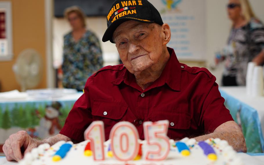 Navy World War II veteran Bill Monfort, who turned 105 on Dec. 17, 2021, celebrates with members of his church on Dec. 19, 2021 in Tampa, Fla. Monfort lived through the attack on Pearl Harbor and fighting in the Pacific during WWII as a member of the Navy. He recently survived a COVID-19 infection as well (during the summer of 2020, before vaccines were available). 