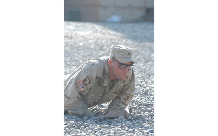 Pfc. Josh Wolfgram, 20, from Wahpeton, N.D., does push-ups as punishment for not wearing his helmet at the 101st Airborne Division’s air assault school at Qayyarah West Air Field in northern Iraq. Wolfgram is with A Company, 3rd Battalion, 327th Infantry Regiment, 1st Brigade Combat Team.