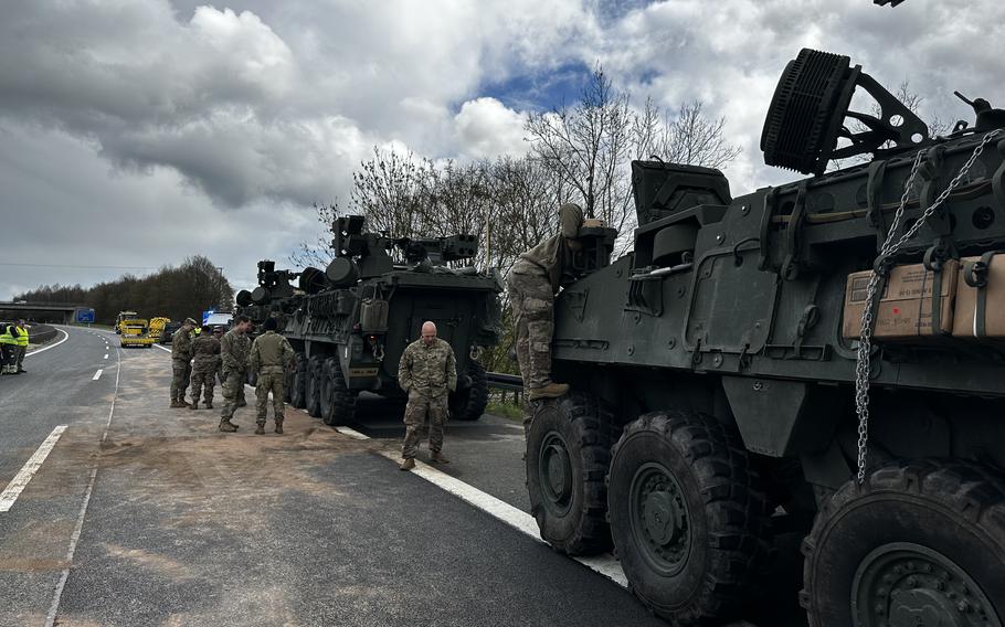 Soldiers check their vehicles following the crash of two others April 17, 2023, on highway A6 near Amberg, Germany. Seven vehicles were traveling in a convoy between Sulzbach-Rosenberg and Amberg-West in Bavaria. Seven soldiers were injured during the crash.
