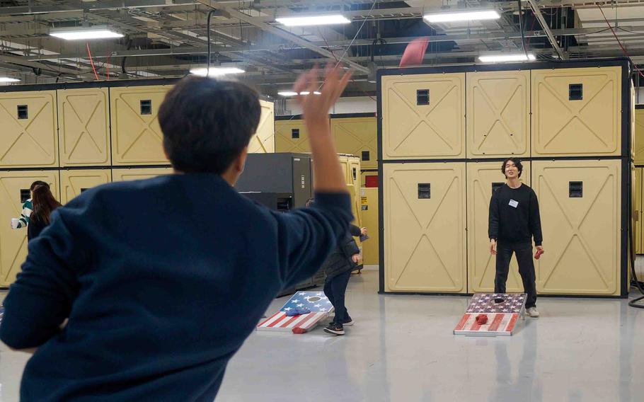 Pyeongtaek University students learn how to play cornhole during a tour of Camp Humphreys, South Korea, Jan. 17, 2024.