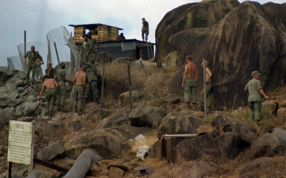 Men install RPG wire