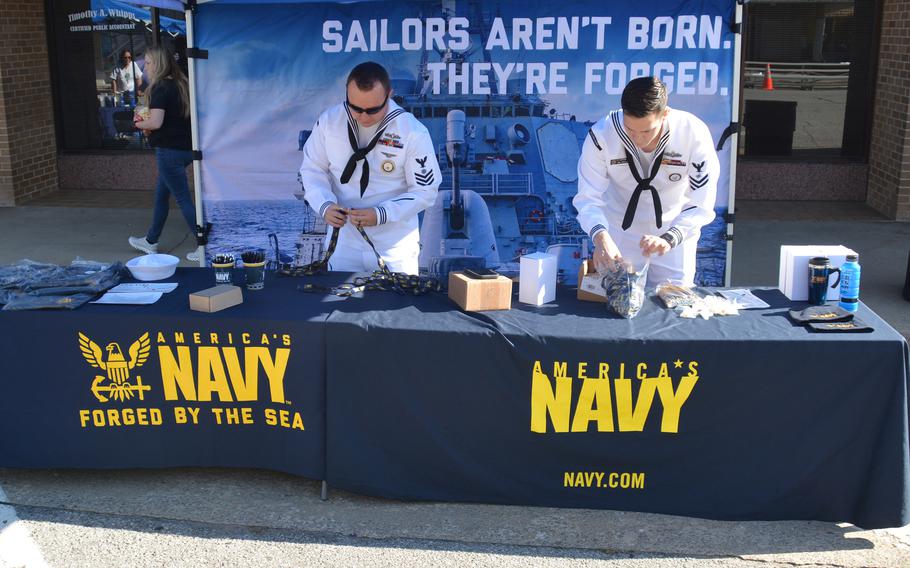 Sailors from Navy Talent Acquisition Group Red River set up a booth at the 75th Anniversary Armed Forces Day Parade in McAlester, Okla., in May 2022. NTAG Red River encompasses 150,000 square miles that includes North Texas and Oklahoma, and consists of 40 enlisted recruiting stations, three officer recruiting stations, and three Military Entrance Processing Stations. 