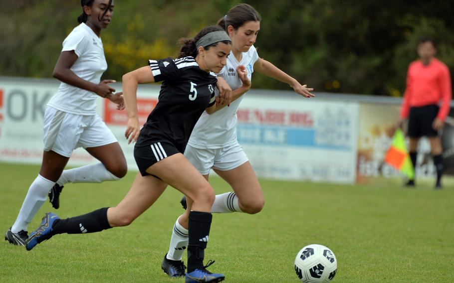 Vicenza’s Dariadna Lopez-Nieves, left, and Marymount’s Giorgia Gariglio sprint after the ball in a Division II game won by Vicenza 3-0, at the DODEA-Europe soccer finals at Reichenbach-Steegen, Germany, May 21, 2024. 