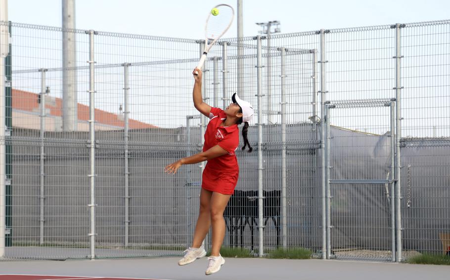 Marisol Hindie serves the ball.