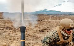 Marine Cpl. Darren Zavala, a mortarman with the 31st Marine Expeditionary Unit, fires an 81mm mortar at Combined Arms Training Center Camp Fuji, Japan, March 23, 2022.