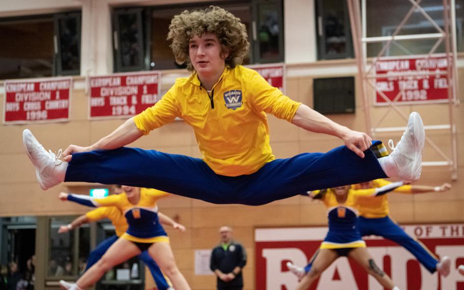 Jack Hatch and the Wiesbaden Warriors cheer team perform a routine at the 2023 DODEA-Europe Cheerleading Championships at Kaiserslautern High School on Friday, Feb. 18, 2023. Wiesbaden placed first in the Division I team competition