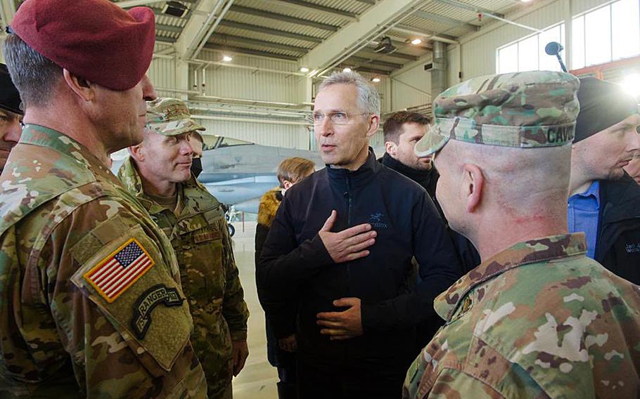 NATO Secretary-General Jens Stoltenberg speaks to American generals at Lask Air Base, Poland, March 1, 2022. From left, NATO Supreme Allied Commander Europe Gen. Tod Wolters, Lt. Gen. Erik Kurilla, XVIII Airborne Corps commander and Gen. Christopher G. Cavoli, commander, U.S. Army Europe-Africa. 