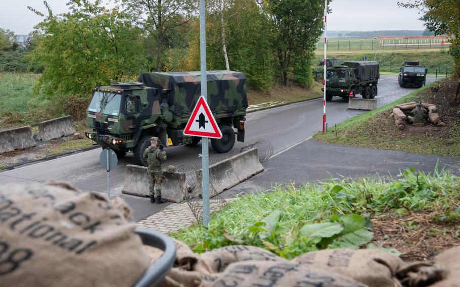 A convoy of American military vehicles participates in a troop movement exercise with German forces at a military base outside Cologne, Germany, Oct. 23, 2023.