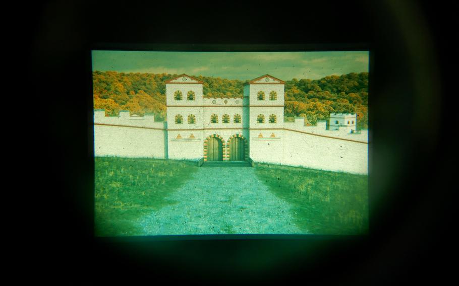 A view through the "Archaeoskop," a binocular-like contraption that shows the visitor how experts think the Roman fort at Osterburken looked in the third century. Today, only the foundations of some of the buildings remain, but an outline of the gate, made with steel pipes, lets one get an idea of how big it once was.