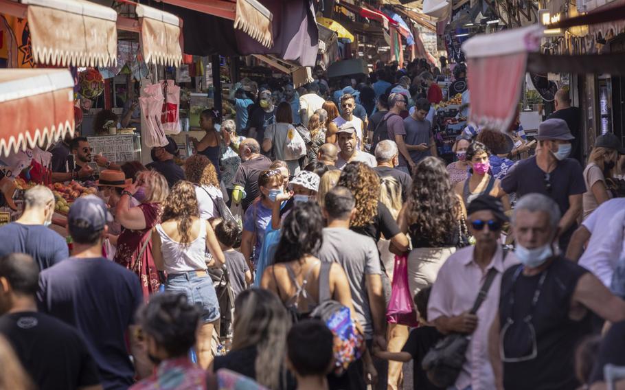 Crowds of shoppers in Carmel Market in Tel Aviv in 2021. 