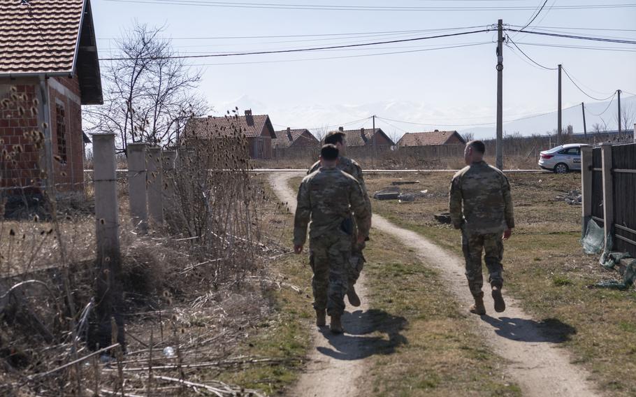 U.S. soldiers conduct a foot patrol in Babush, an ethnic Serbian enclave in Ferizaj, Kosovo, Feb. 22, 2024. A quarter-century after NATO launched a bombing campaign to stop the ethnic cleansing of Albanians in Kosovo, international peacekeeping troops remain on the ground and the security situation remains fragile. 