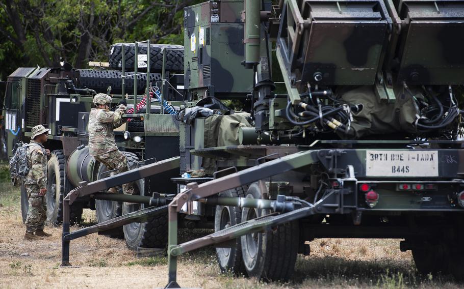 U.S. Army Staff Sgt. Aaron Agsaoay watches Spc. Rem Mendoza climb down from a Patriot launcher at Clark Air Base, Philippines, May 2, 2024. 