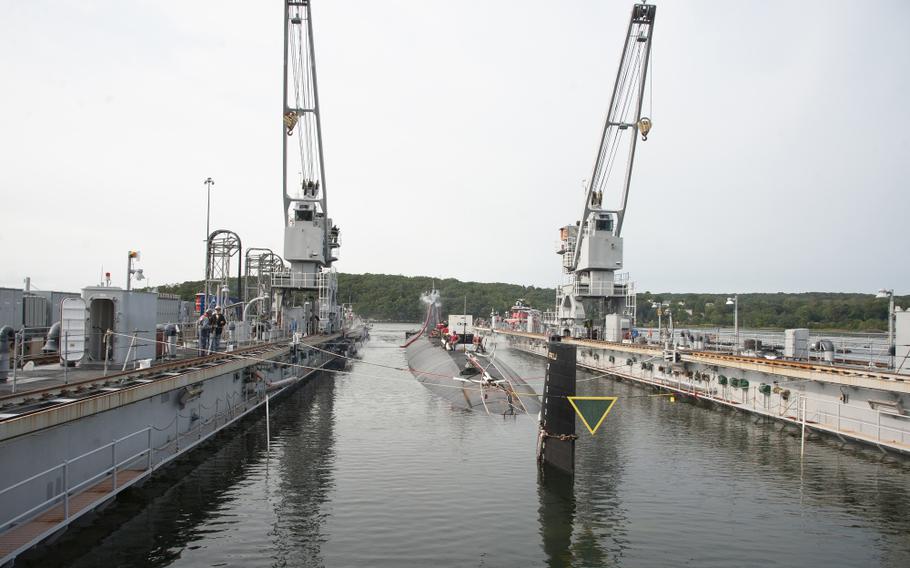 The Los Angeles fast attack submarine USS Hartford is guided out of the floating dry dock, ARDM 4 on Thursday, September 17, 2020 at Submarine Base New London in Groton. General Dynamics Electric Boat is conducting repairs on the USS Hartford, a Los Angeles-class attack submarine, after the Department of Defense awarded Electric Boat a $64-million modification to an existing $125 million contract for the overhaul of the submarine.